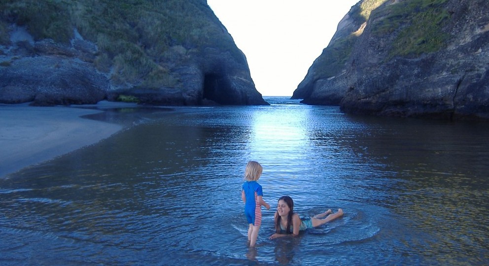 Nur with her brother on Wharariki Beach.  (Photo by Nur's mum, Michal)