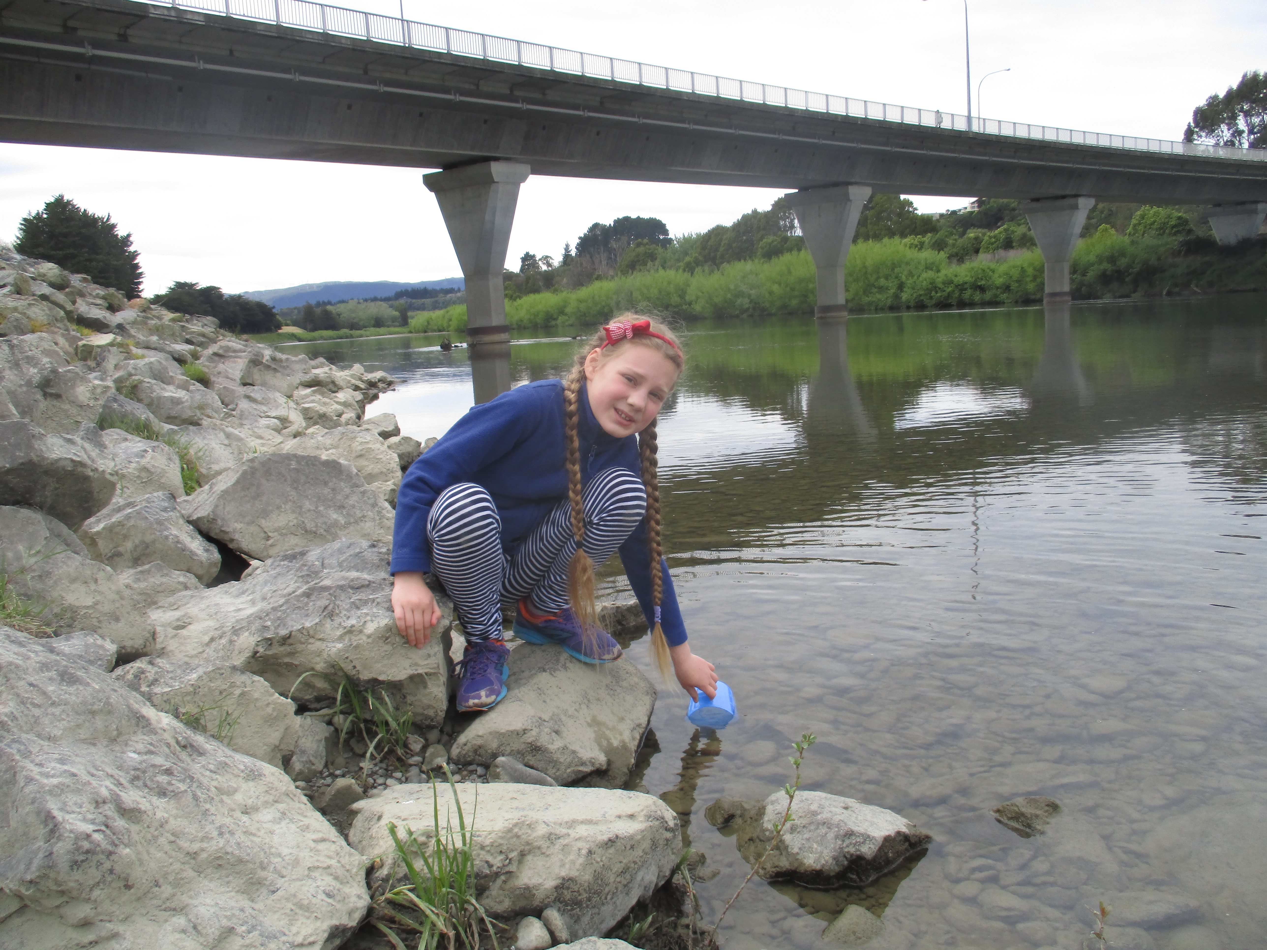 Esther taking a water sample from the Manawatu river